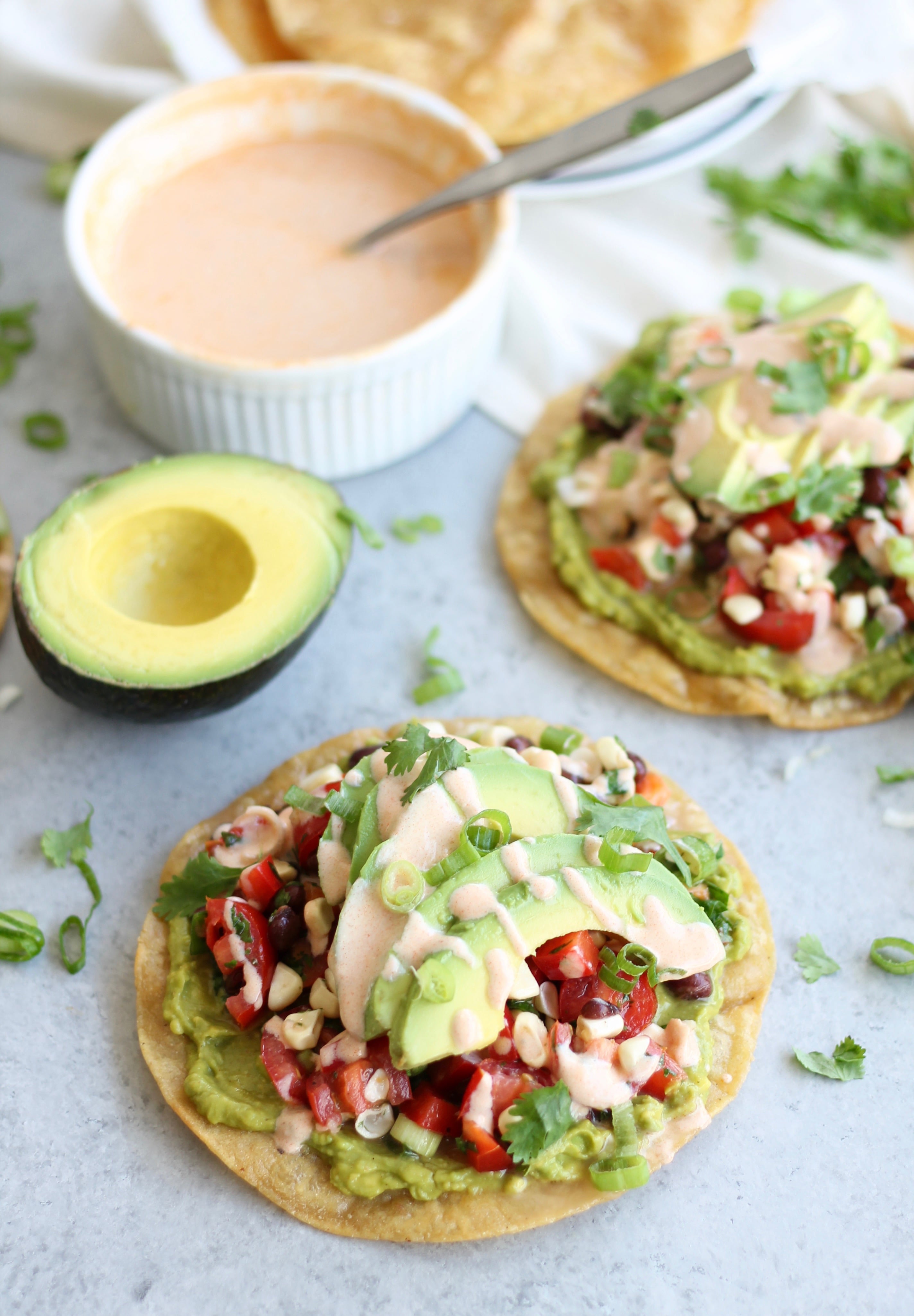 Smashed Avocado, Black Bean, and Corn Tostadas with Chipotle Crema