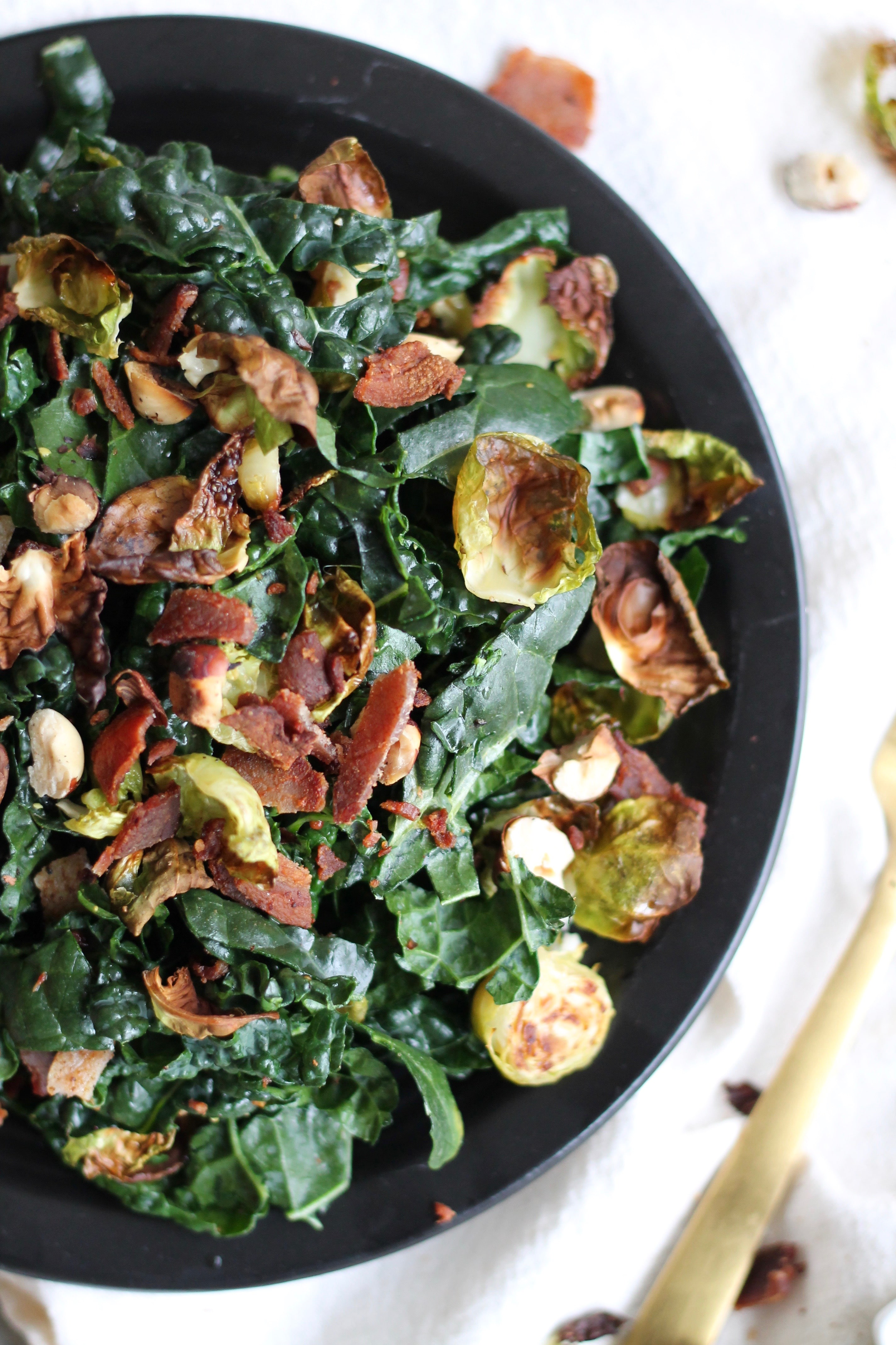 Crispy Brussels Kale Salad with Maple Bacon Dressing and Toasted Hazelnuts