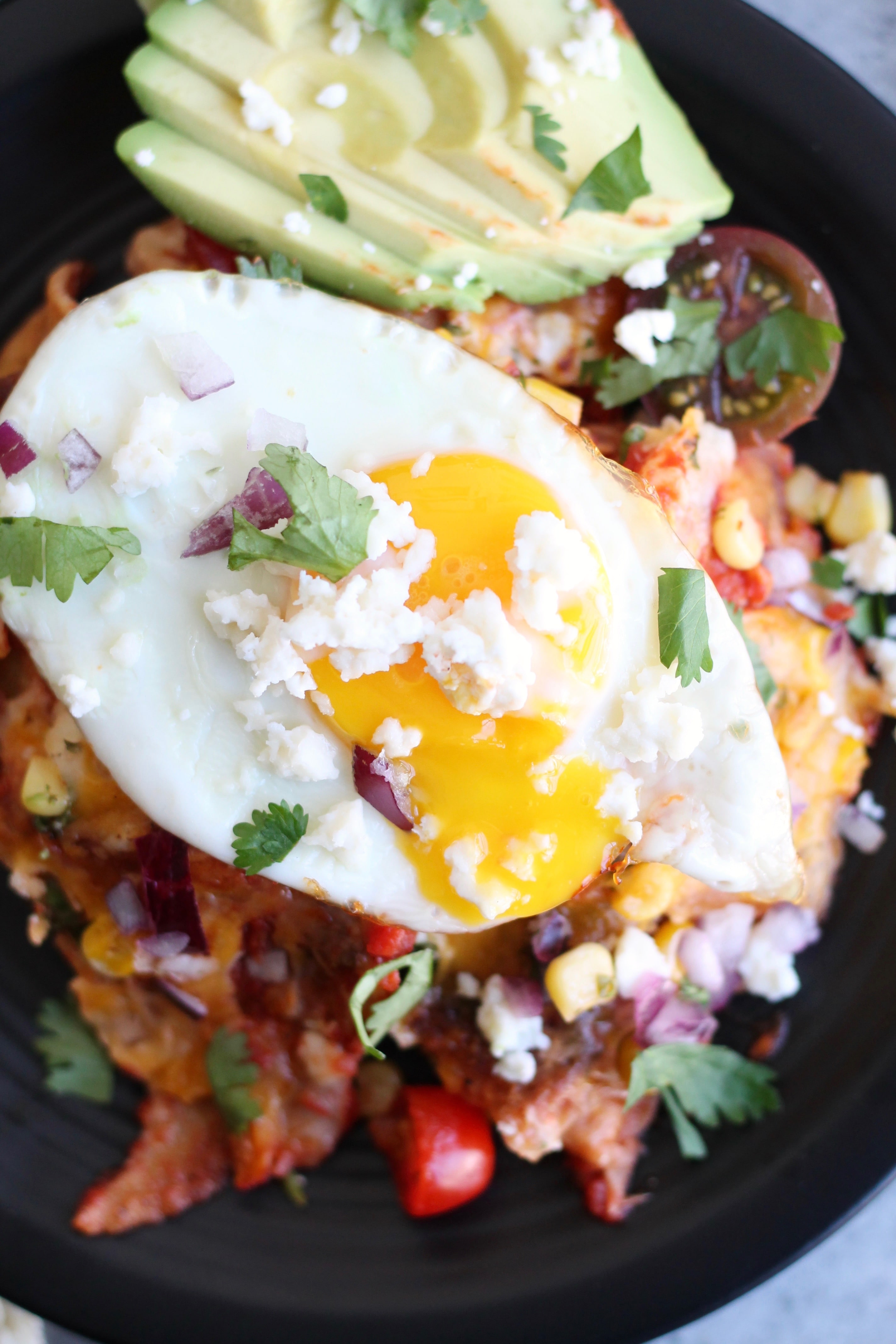 Mexican Street Corn Chilaquiles with Smoky Tomato Sauce and Fried Eggs