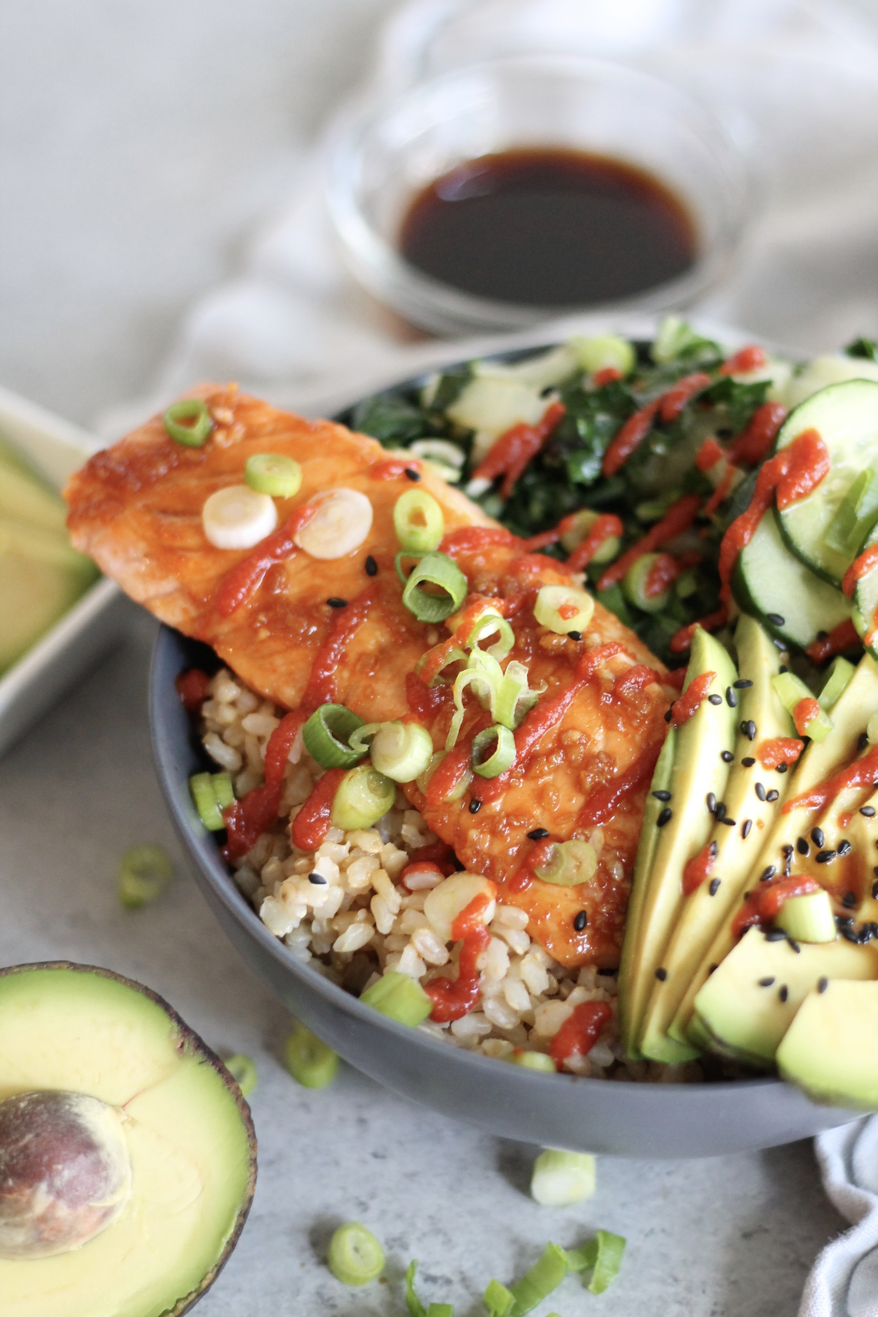 Garlic Sesame Salmon Buddha Bowls with Bok Choy, Avocado, and Cucumbers