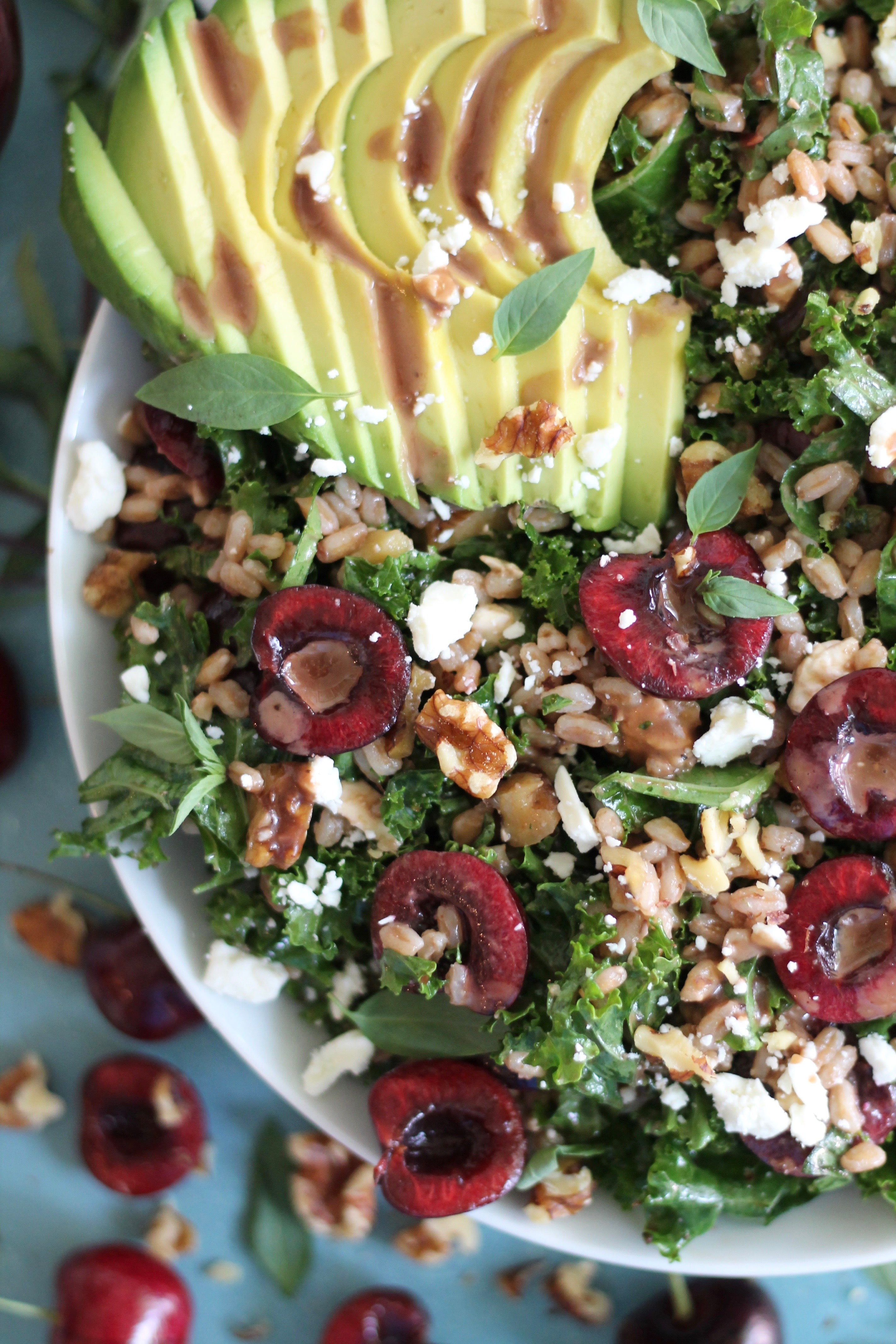 Cherry Kale Salad with Farro, Avocado, Feta, and Cherry Balsamic