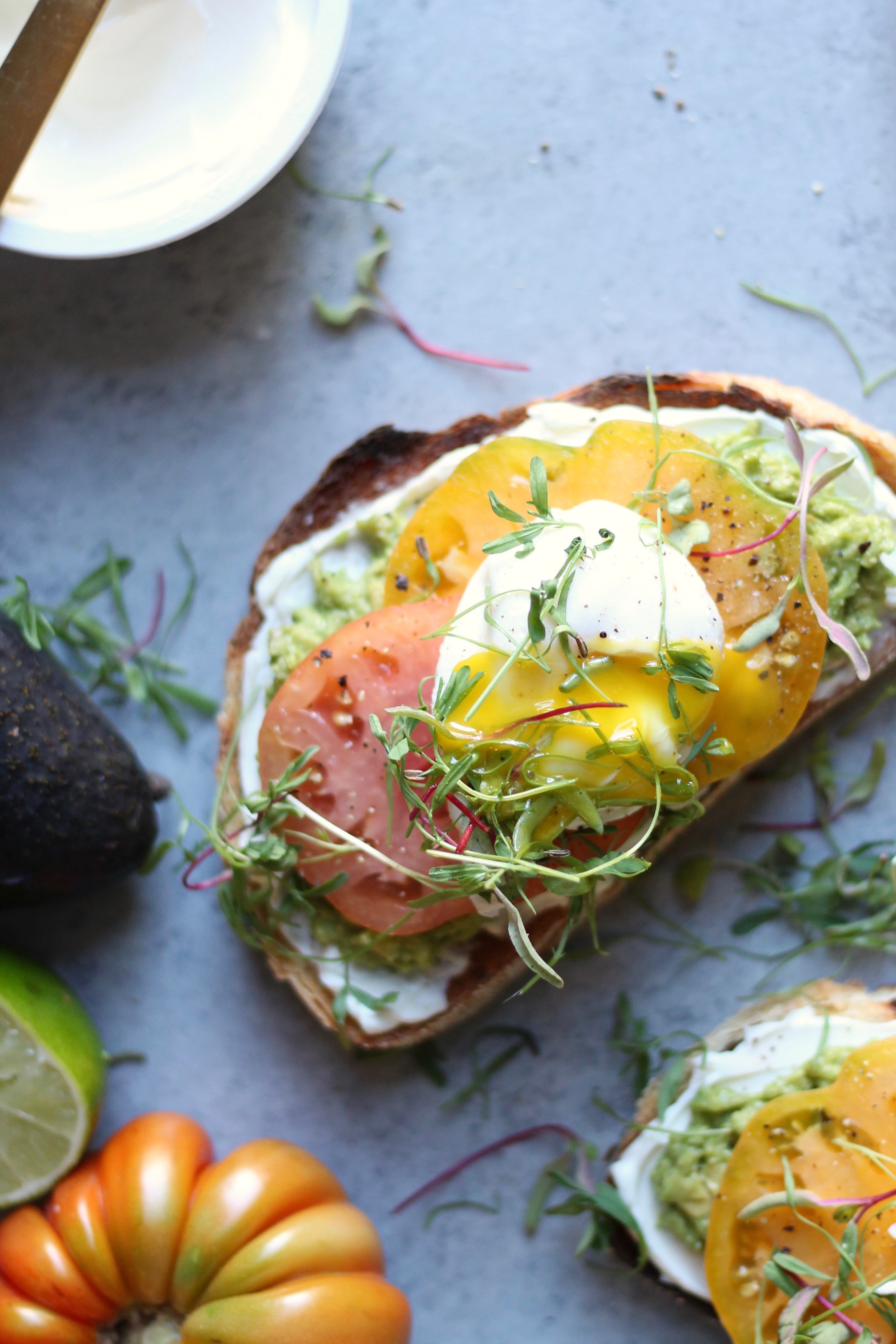 Cream Cheese Avocado Toast with Heirloom Tomatoes and Poached Eggs