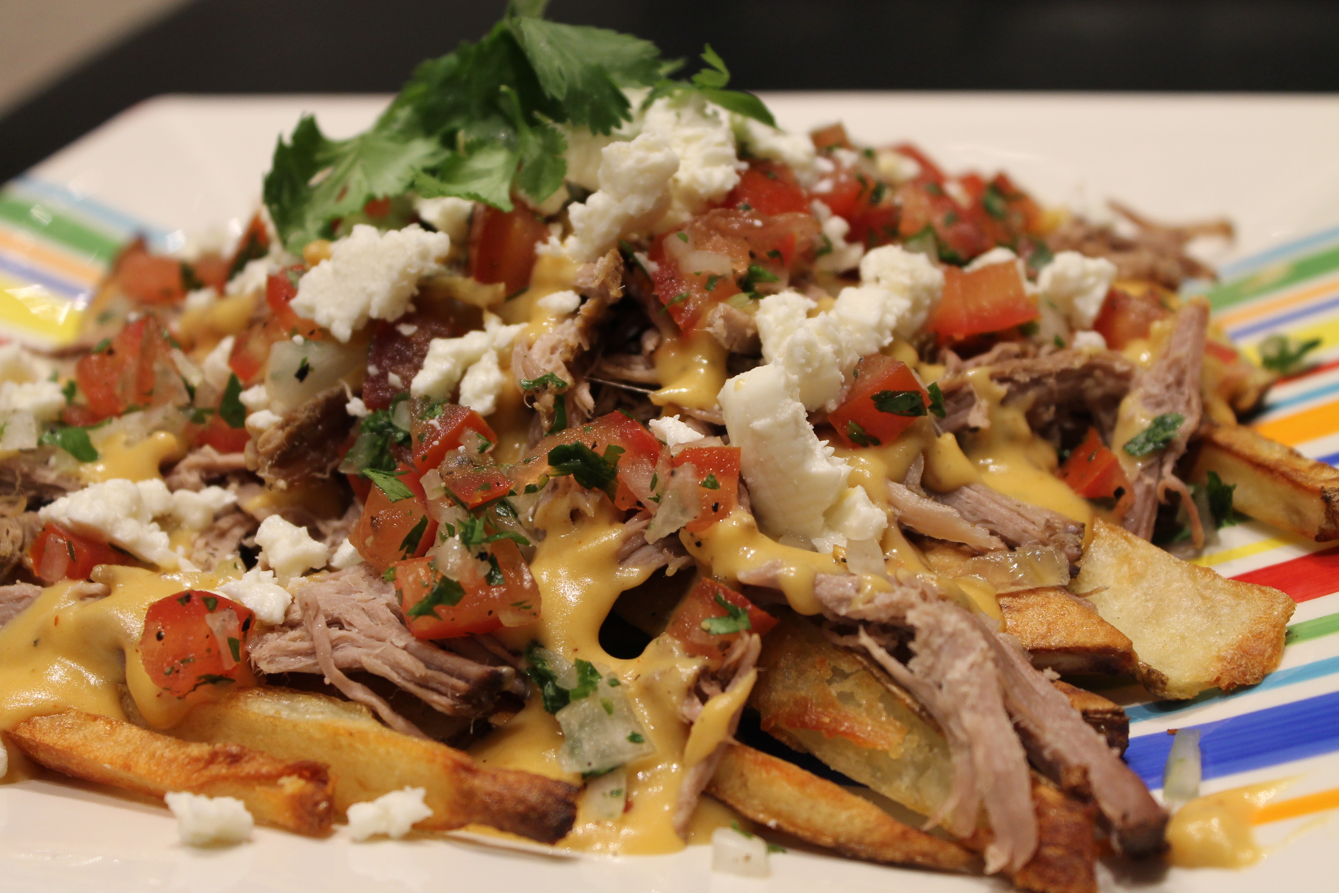 Carnitas Oven Fries with Queso, Pico de Gallo, and Queso Blanco