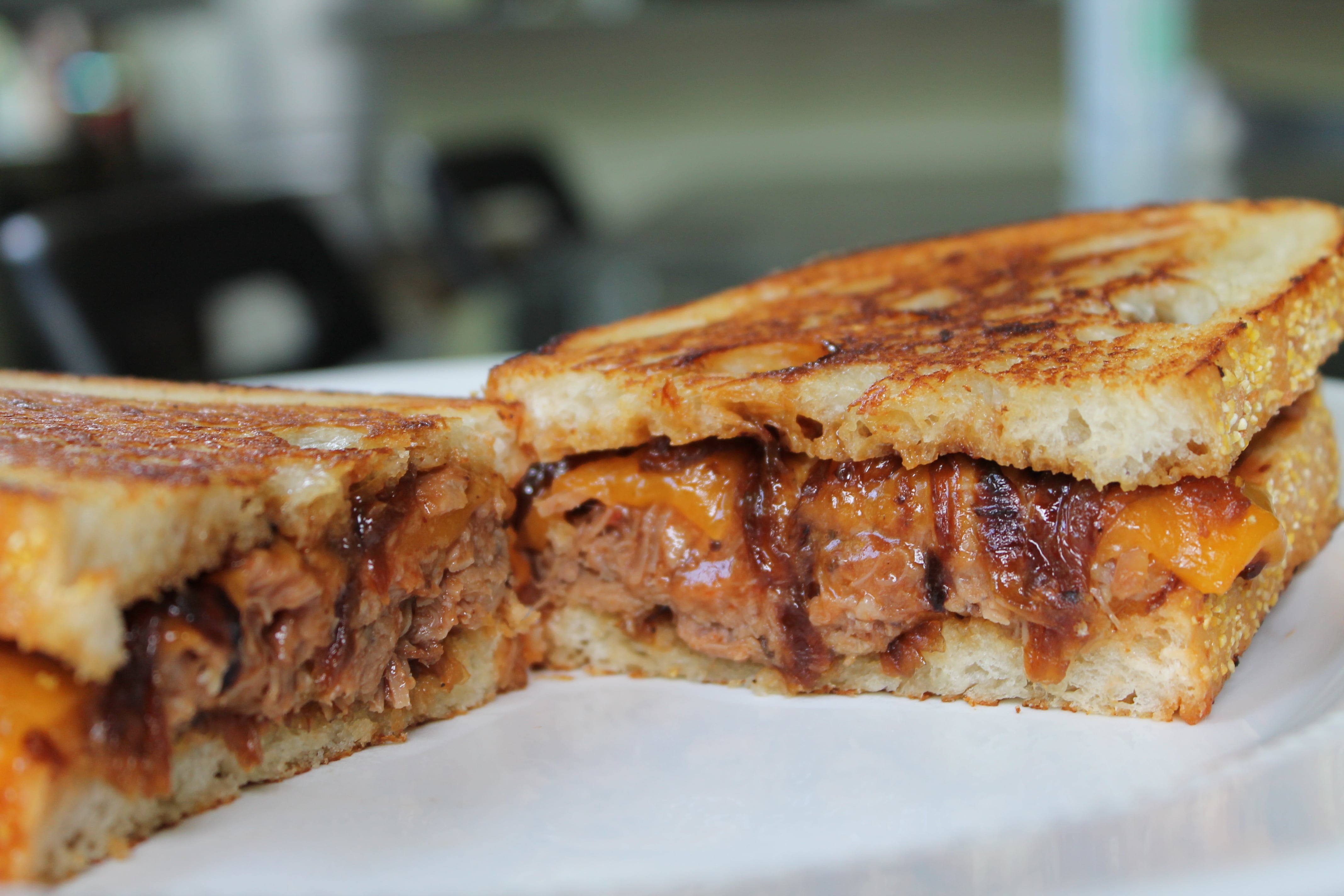BBQ Pulled Pork Grilled Cheese with Beer Caramelized Onions and Sharp Cheddar