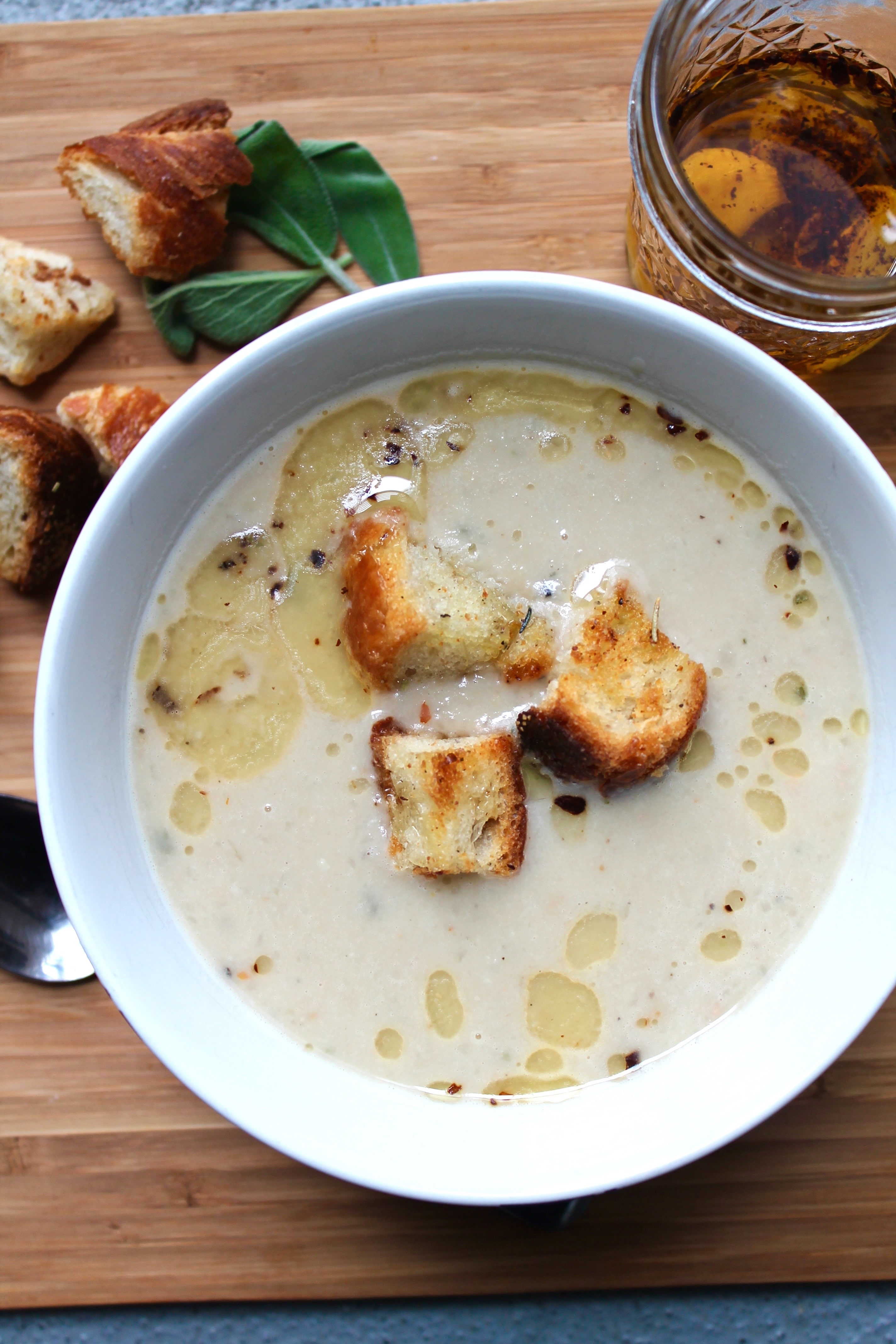 Tuscan White Bean Soup with Herb Croutons and Garlic Chili Oil