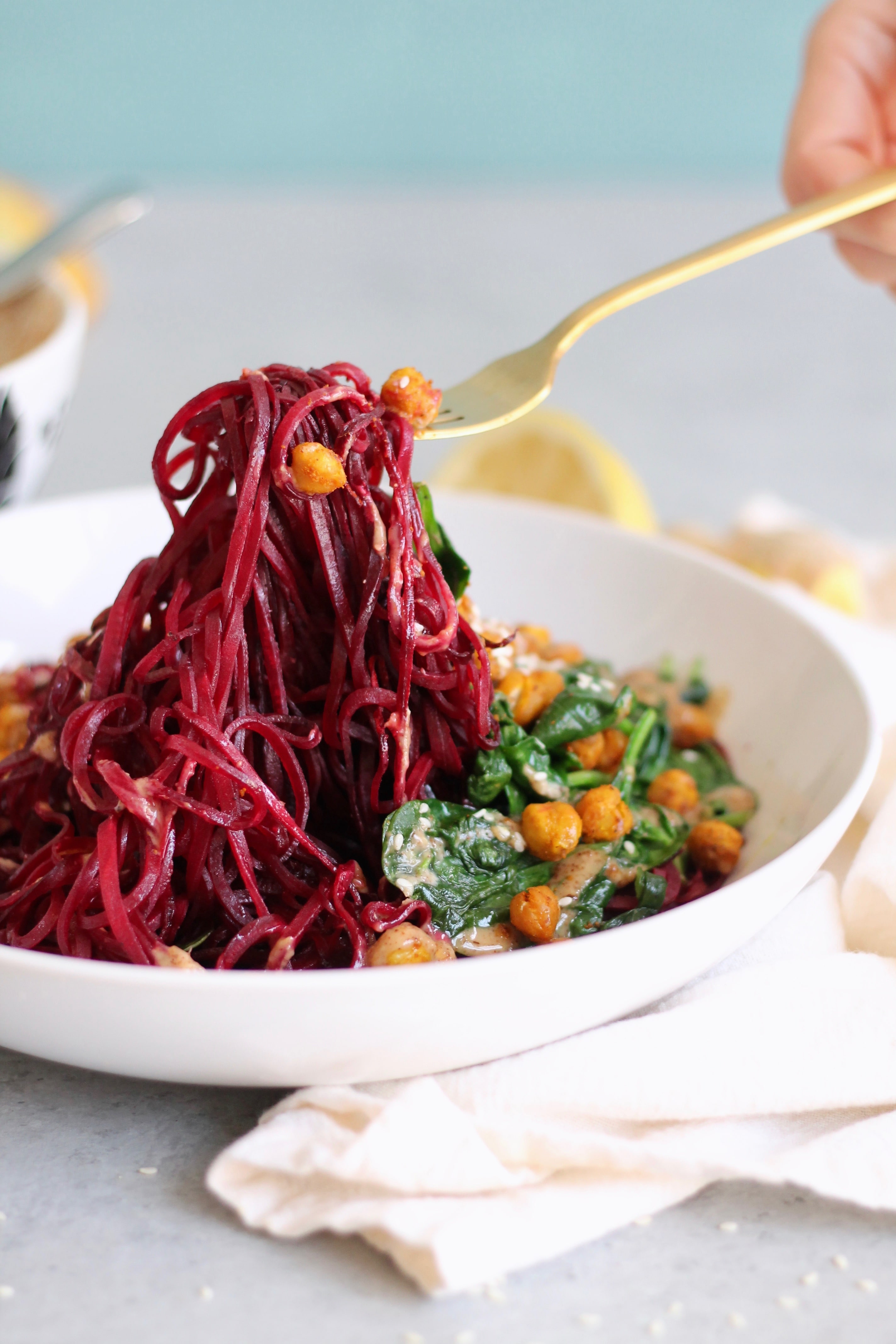 Beet Noodle Bowls with Turmeric Roasted Chickpeas, Spinach, and Ginger Almond Butter Dressing