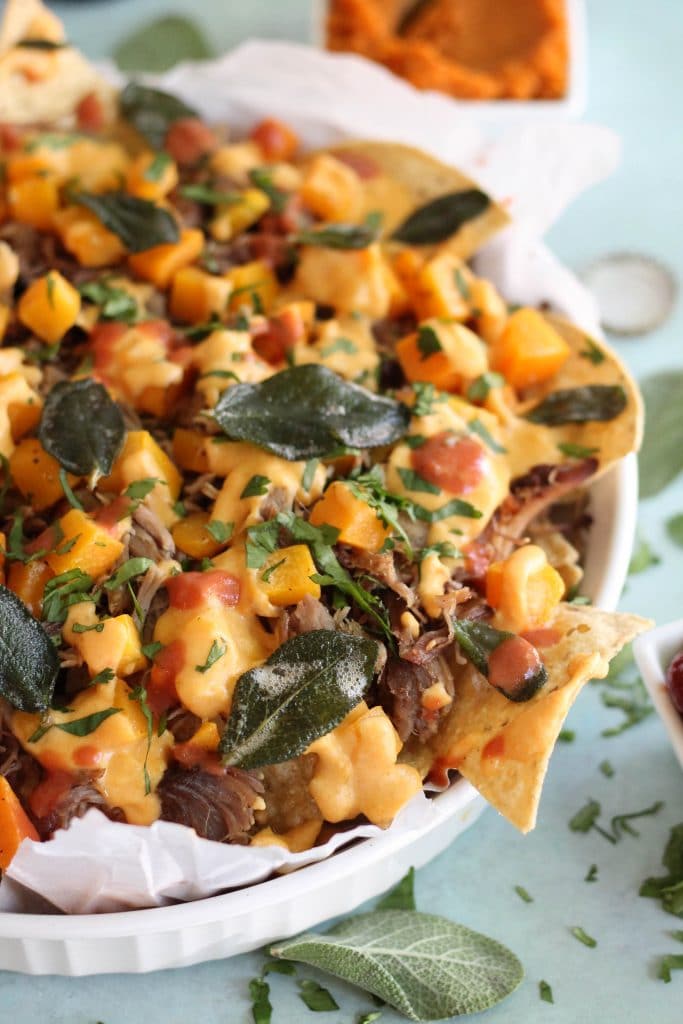 Pulled Pork Nachos with Pumpkin Chipotle Queso, Butternut Squash, and Crispy Sage