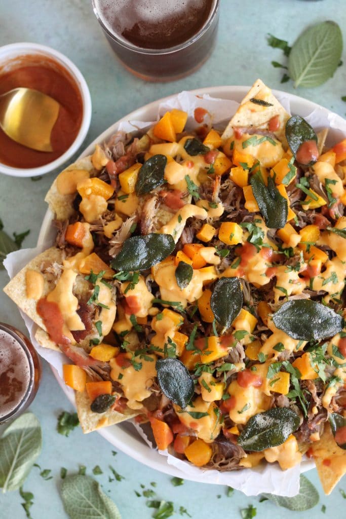 Pulled Pork Nachos with Pumpkin Chipotle Queso, Butternut Squash, and Crispy Sage