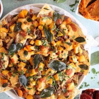 Pulled Pork Nachos with Pumpkin Chipotle Queso, Butternut Squash, and Crispy Sage