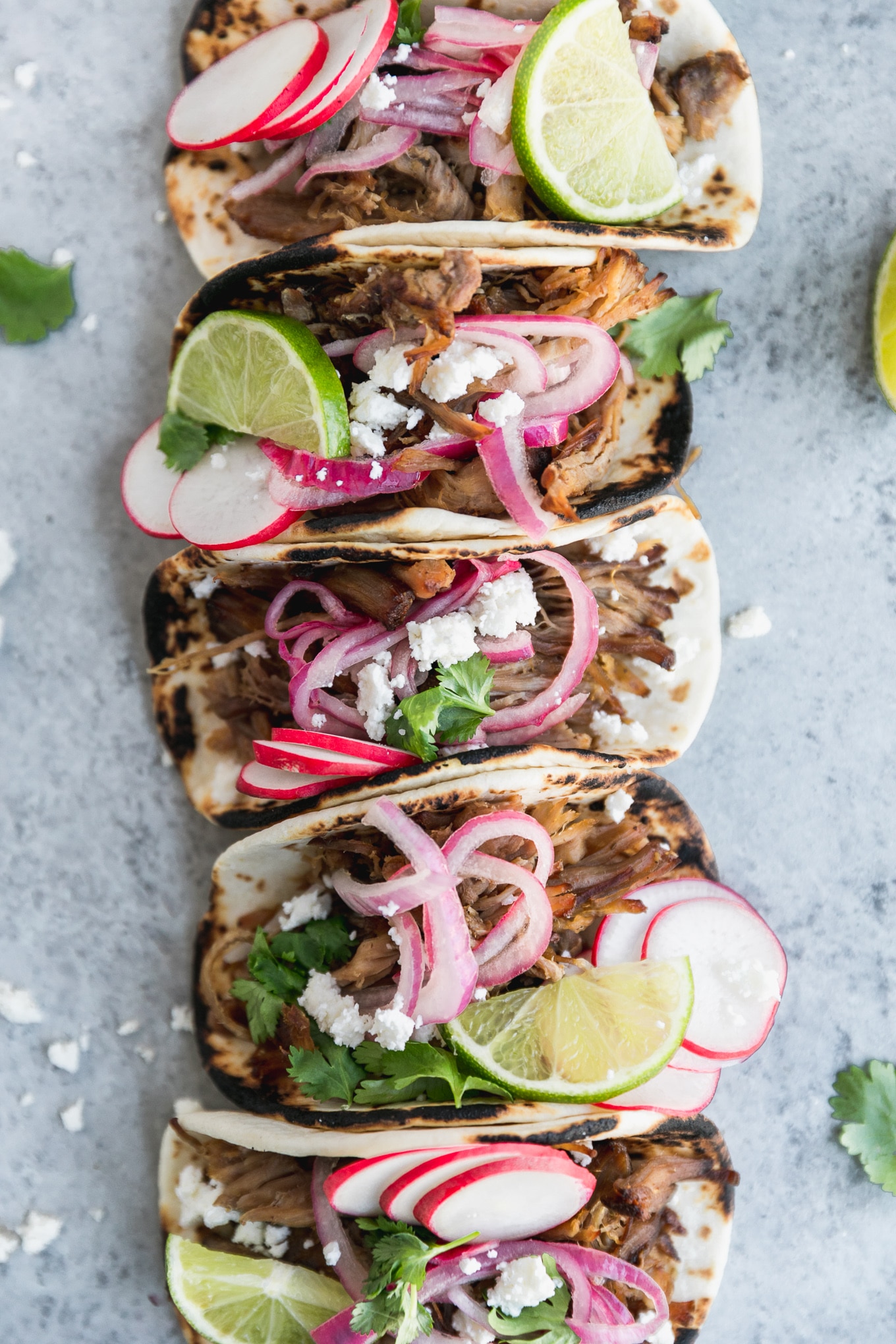 Slow Cooker Carnitas Street Tacos with Pickled Red Onions and Queso Fresco