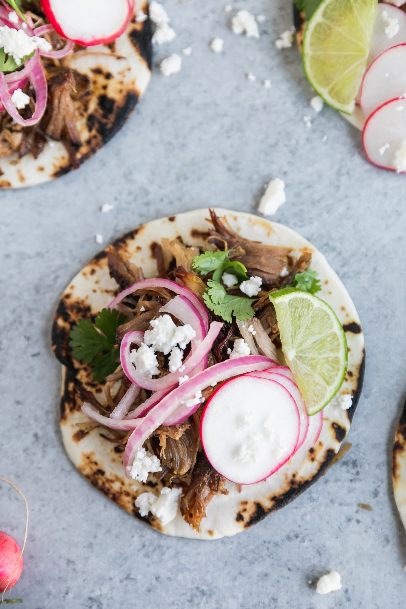 Slow Cooker Carnitas Street Tacos with Pickled Red Onions and Queso Fresco