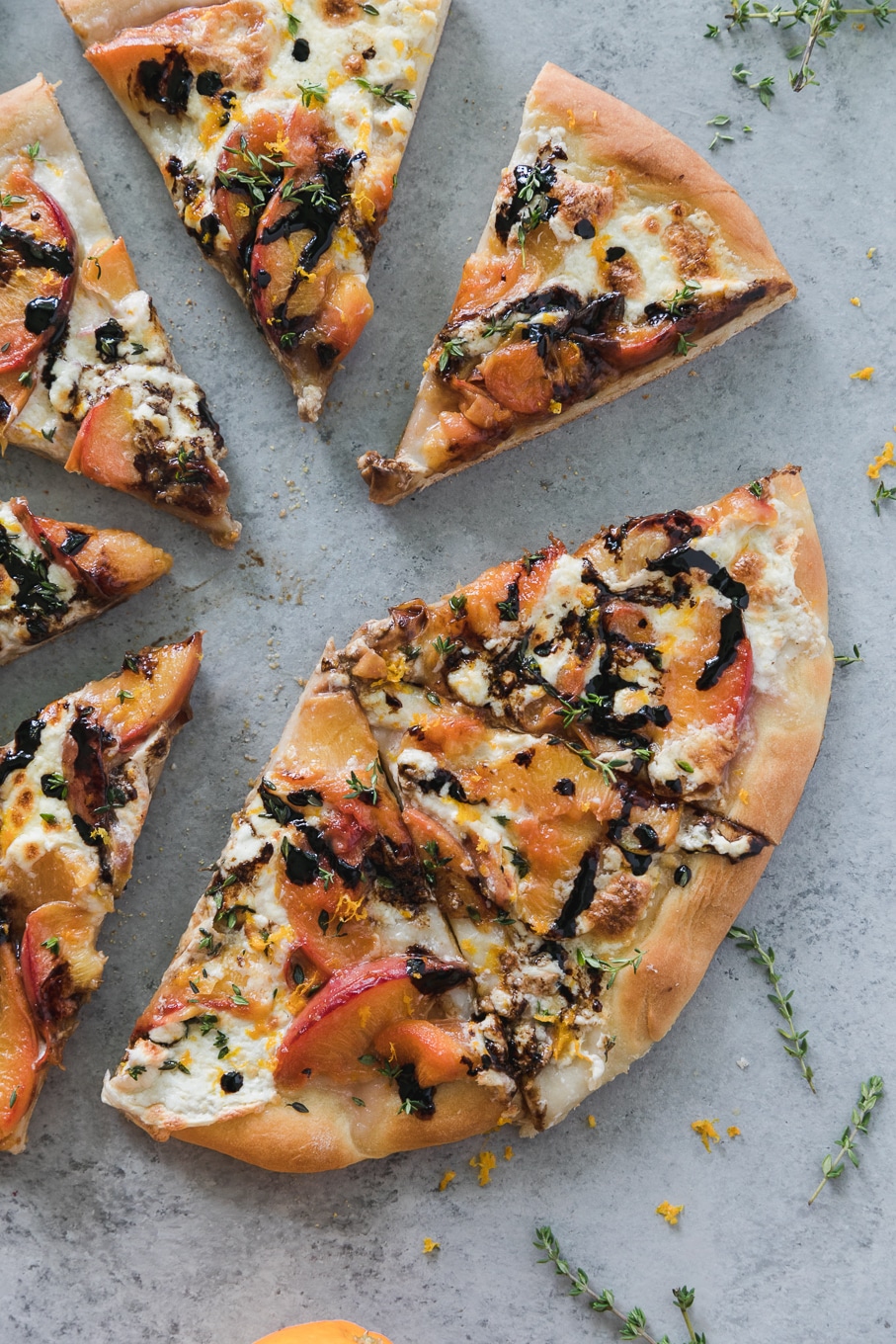 Overhead shot of a peach pizza cut into 8 slices