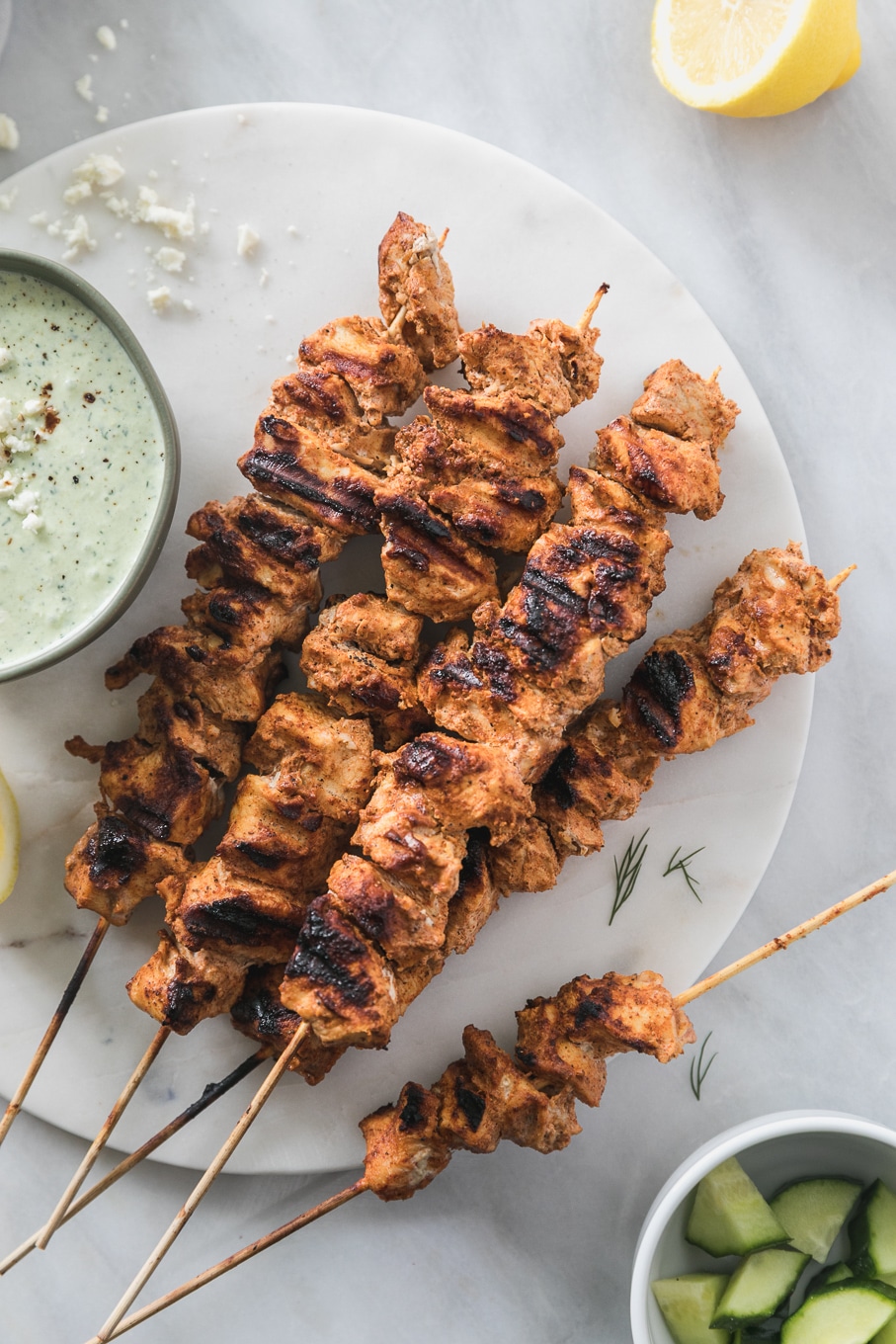 Overhead shot of a pile of grilled chicken skewers