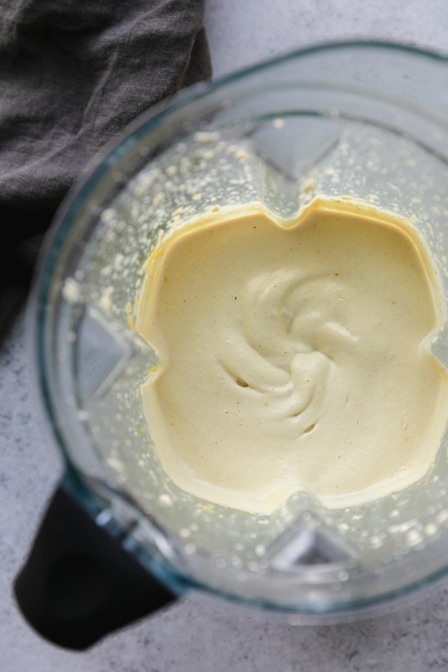Overhead shot of a blender filled with cashew queso