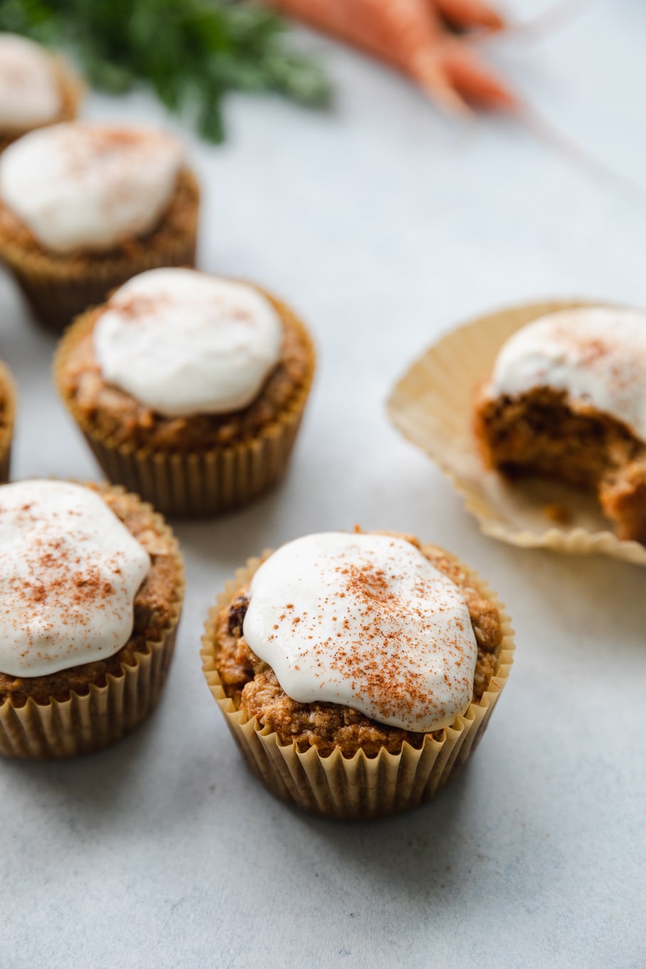 Close up shot of cream cheese glazed carrot cake muffins
