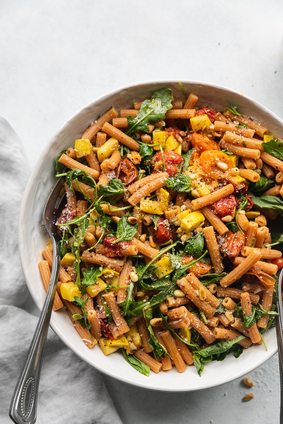 Garlic Roasted Tomato Lentil Pasta with Arugula and Toasted Pine Nuts