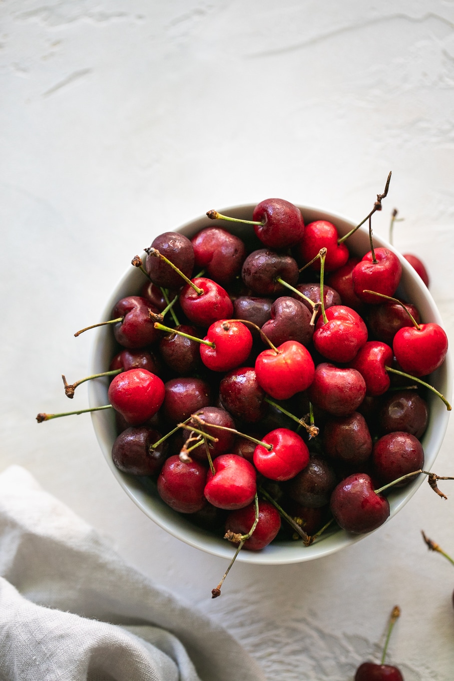 Overhead shot of a bowl of red cherries