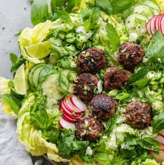 Overhead shot of a vietnamese salad with pork meatballs