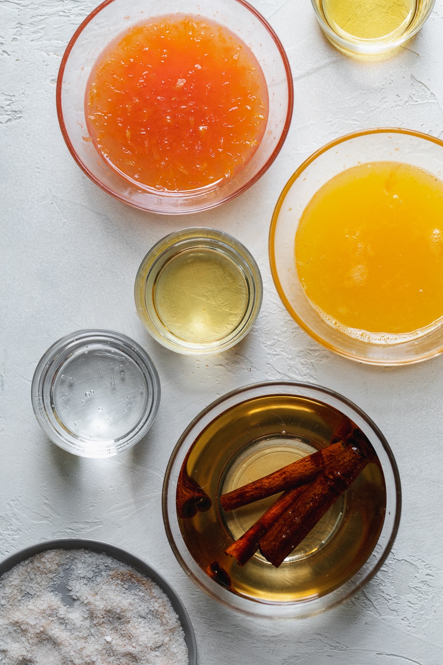 Overhead shot of cocktail ingredients in small bowls