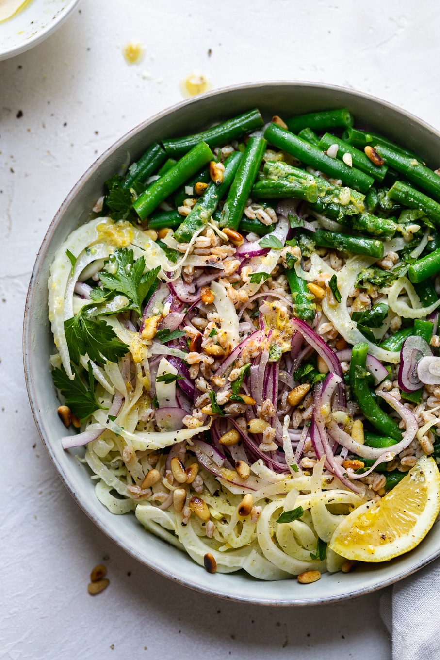Overhead close up shot of a colorful green bean salad