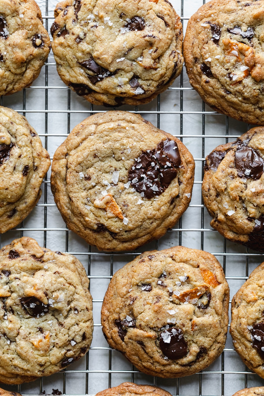 Overhead shot of cookies with sea salt on a cooling rack