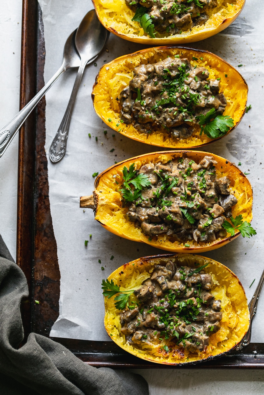 Overhead shot of 3 creamy mushroom filled spaghetti squash halves