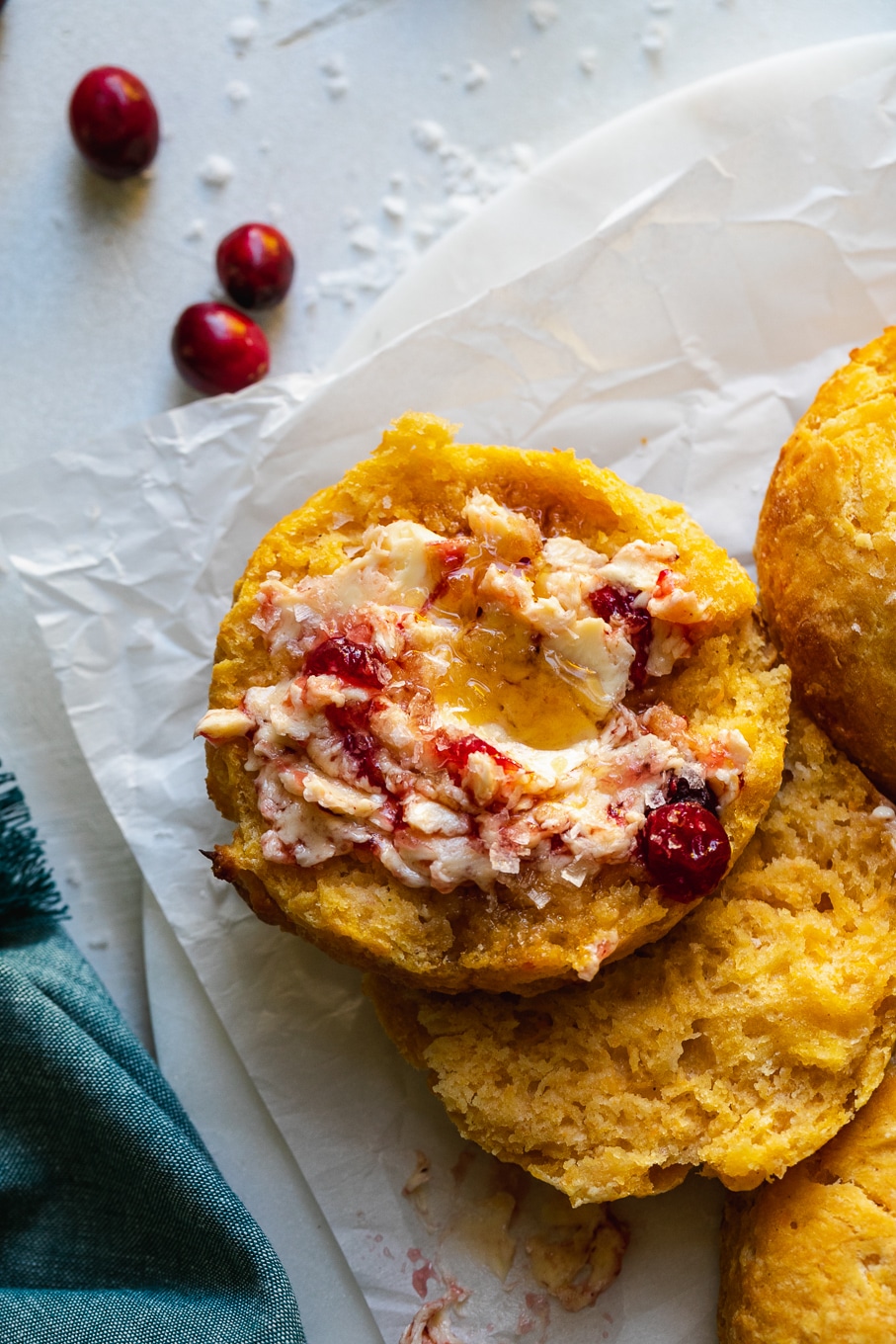 Close up shot of a halved biscuit with cranberry maple butter