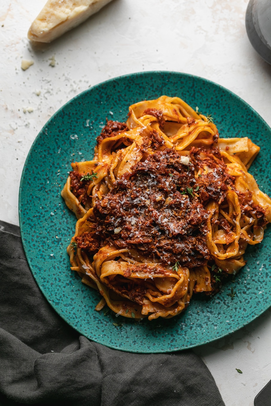 Overhead shot of pasta on a turquoise plate