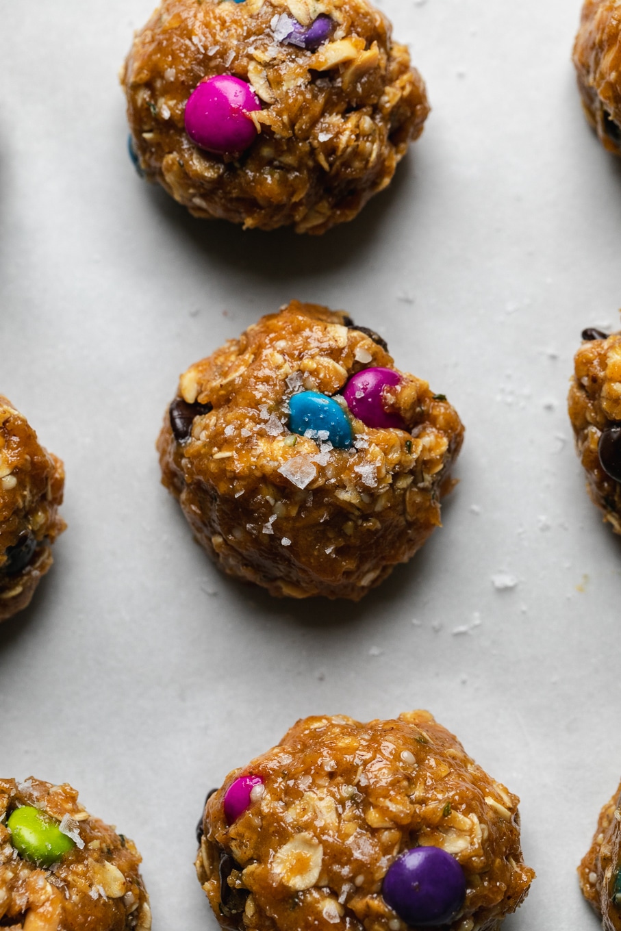 Overhead close up shot of cookie dough balls on a baking sheet