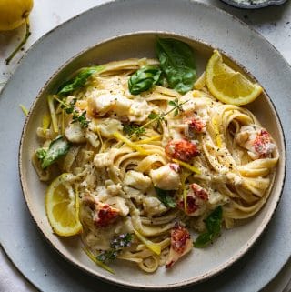Overhead shot of a bowl of lemon pasta with lobster